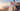 Trois modèles portant les maillots de l'Olympique de Marseille 2026/27, domicile blanc, extérieur bleu clair et third bleu marine, avec vue sur Marseille.