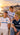 Collection OM 2026/27 avec trois modèles portant les maillots Puma blanc, bleu clair et bleu marine, devant le Vieux-Port de Marseille au coucher du soleil.