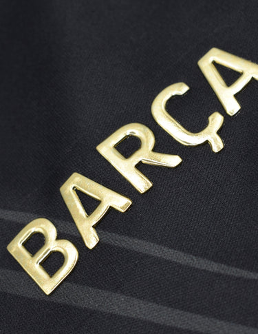 Logo FC Barcelone sur le maillot entraînement 2025/26 noir or.